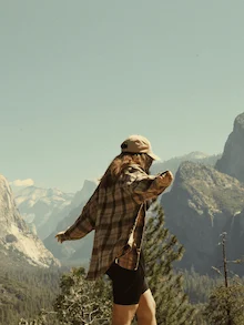 The photo full of freedom and air, with a woman along the mountains.