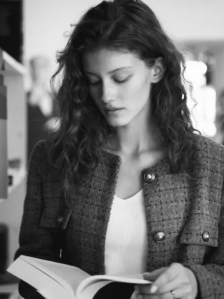 The photo of me reading some kind of book. 