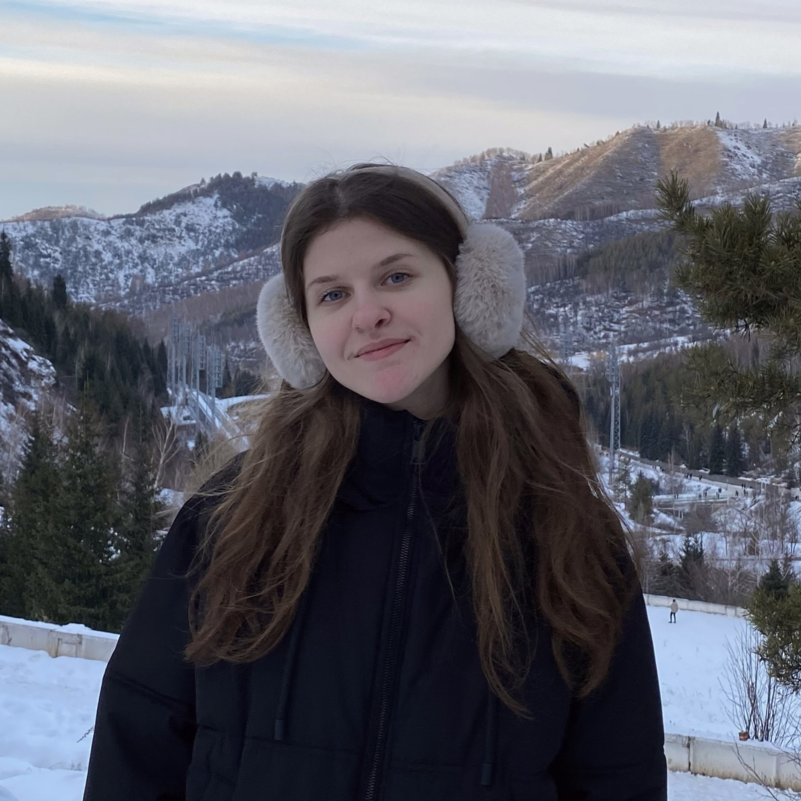 The author on the background of a winter landscape.